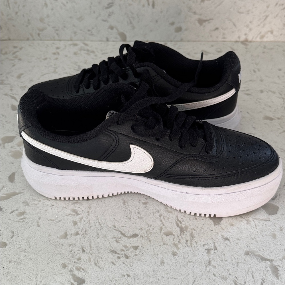 Nike Court Vision Alta leather platform sneakers in black and white